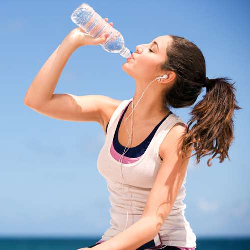 best skin treatment advice in lahore, best skin specialist in lahore, girl drinking water for skin glow and hidration
